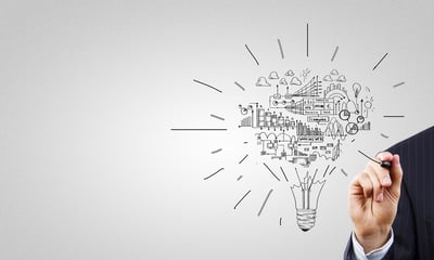 img-man-writing-on-glass-panel-light-bulb-and-business-data