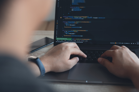 img-man-writing-computer-code-on-computer-01