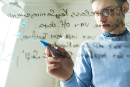 img-man-writing-computer-code-on-glass-01